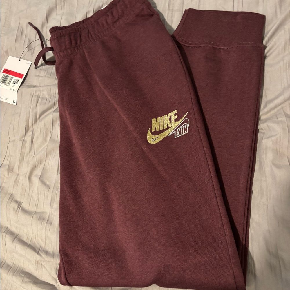 Nike slim fit midrise joggers size large. Color is a light burgundy/purple-NWOT